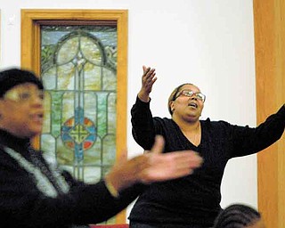 Youngstown resident Lillian Howell of Elizabeth Missionary Baptist Church sings praises during a united Thanksgiving worship service with New Birth-Kimmelbrook Baptist Church, Metropolitan Baptist Church, Phillips Chapel CME Church and Holy Trinity Church. The Wednesday service was at Elizabeth Missionary Baptist Church.