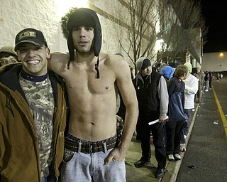 William D. Lewis|The Vindicator A large crowd qued up outside the Boardman Best Buy at 5am Friday to get Black Friday bargins. Among those in line were Miguel Sanchez, left, and John dutton both of Lowellville.
