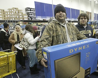 William D. Lewis|The Vindicator A large crowd qued up outside the Boardman Best Buy at 5am Friday to get Black Friday bargins. Among the shopper to find just what they were looking for were Trevor Motsko, left, and Josh Cutlip of Struthers.