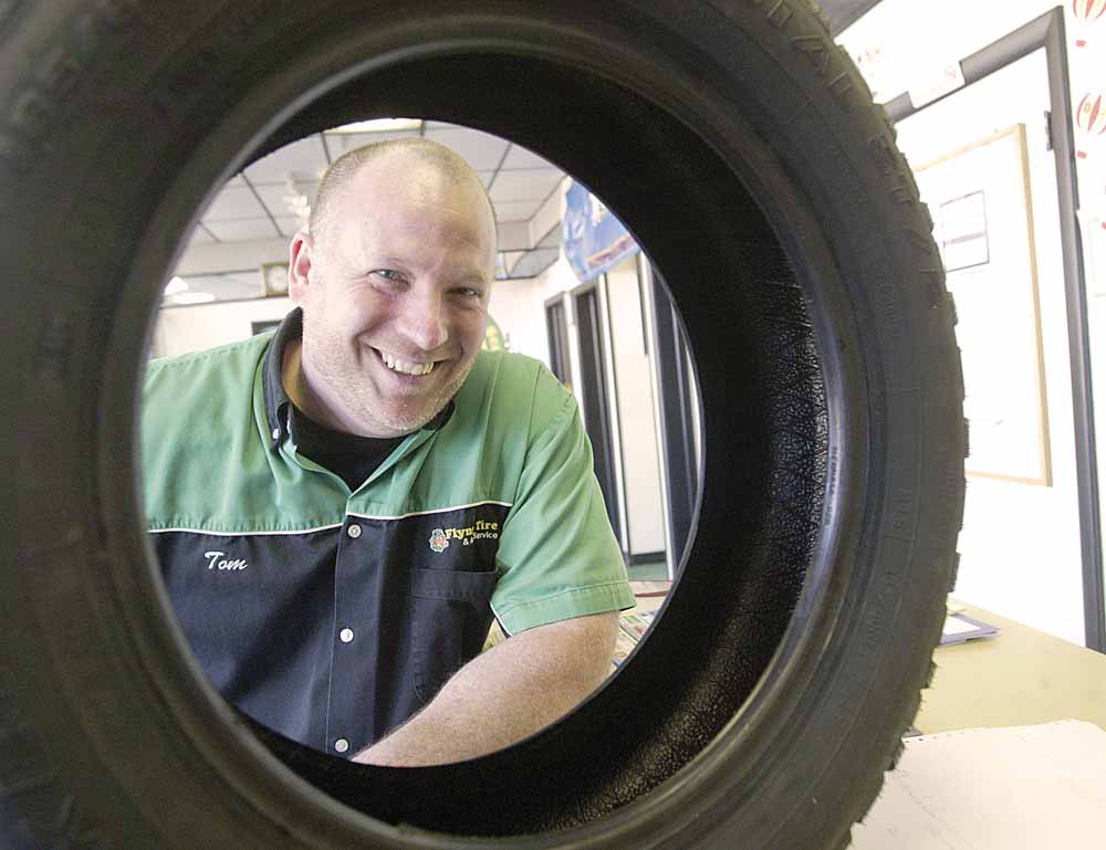 Tom Schadl, manager of Flynn’s Tire & Auto Servicein Youngstown, is pushing the snow tires this year for winter driving. 