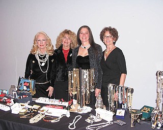 Angels for Animals, 4750 state Route 165, Canfield, will host its 7th annual Antiques and Holiday Decoration Show just in time for the holiday season. There will be a $5 admission charged for the preview from 6 to 9 p.m. Friday. From 10 a.m. to 3 p.m. Saturday and from noon to 4 p.m. Sunday there will be no charge. A large variety of collectibles, antiques and jewelry will be available, and all proceeds will benefit the animal shelter and its low-cost spay and neuter programs. Wearing and displaying some of the jewelry collected for the sale are, from left, Ruth Nabb; Chris Vogel; Diane Less, founder of Angels for Animals; and Susie Cope, chairwoman for the event. To donate items for the sale or for more information call 330-502-5352. 