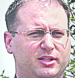 GROUND BREAKING - (l-r) Terry Stocker and Tim Ryan listen to George Krinos at the ground breaking Friday morning. - Special to The Vindicator/Nick Mays