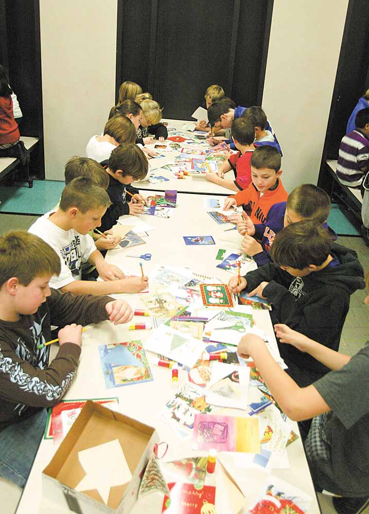 Fourth-grade students at Poland North Elementary worked with the Mahoning County Green Team to reuse holiday greeting cards as ornaments.