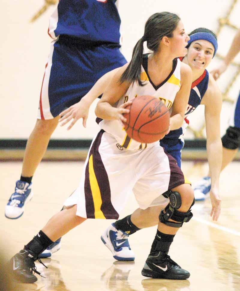 BASKETBALL - (10) Kenzie Pfeiffer of South Range looks for help as (10) Colleen Kenneham keeps a close eye on her during their game Thursday night. - Special to The Vindicator/Nick Mays