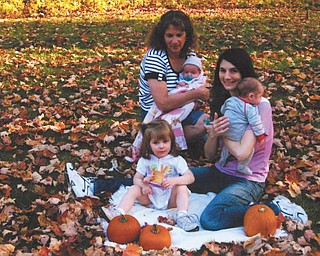 Linda Lamanna of Austintown enjoys a warm fall day with her daughter Jeannine Lindquist and grandchildren Kaylie Eva, center, and twins Jenna Marie and Nicholas James Lindquist. The Lindquist family lives in Minneapolis, Minn. Photo submitted by Linda Lamanna.