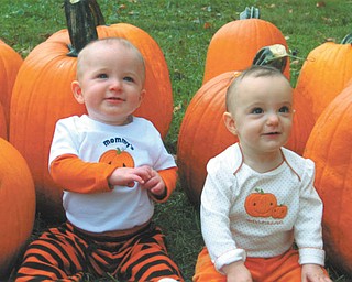 Jimmy, left, and Shayleigh Leslie, 11-month-old twins of Jimmy and Melissa Leslie of Austintown, enjoy going "pumpkin patching" at Whitehouse Fruit Farm. The twins were born in November of 2009. Photo sent in by Jimmy and Melissa Leslie.