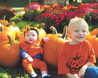 Luke Rowe, 4, right, and his sister Trista, 6 months, picked out their pumpkins at Detwiler Farm in October. They are the children of Mark and Tiffany Rowe of Boardman, who also sent in this photo.
