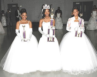 Holding the trophies they received as they were honored at the annual Junior Civic League’s Cinderella Ball are, from left, Tiara Williams, second attendant; Asia Walker, Miss Cinderella; and Keisha Talley, first attendant.