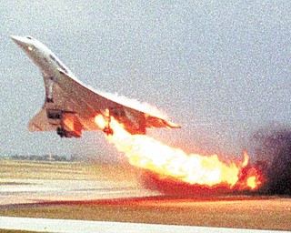 Air France Concorde flight 4590 takes off with fire trailing from its engine on the left wing from Charles de Gaulle airport in Paris, in this July 25, 2000 file photo. The plane crashed shortly after take-off, killing all the 109 people aboard and four others on the ground. A decade after a supersonic Concorde jet crashed in a fiery wreck outside Paris soon after takeoff, killing 113 people, a French court will rule at last Monday Dec 6 2010 on who, if anyone, is to blame.