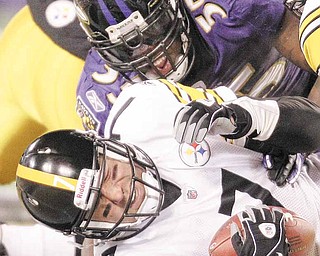 Pittsburgh Steelers quarterback Ben Roethlisberger (7) is sacked by Baltimore Ravens linebacker Terrell Suggs (55) during the first half of an NFL football game, Sunday, Dec. 5, 2010, in Baltimore.