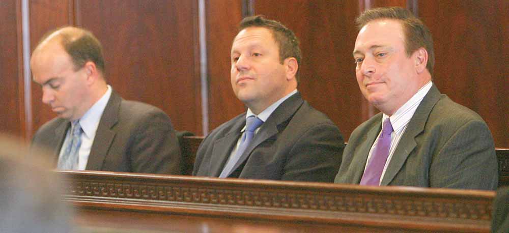 Mahoning County Commissioner John McNally, Auditor Mike Sciortino and Joe Bell listen as attorneys made arguments Monday at the Mahoning County Courthouse during a the hearing on the Vindicator's and 21 WFMJ-TV's motion to unseal Oakhill criminal conspiracy case filings and on the Cafaro Co.'s motion to dismiss the indictment. 