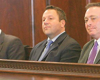 Mahoning County Commissioner John McNally, Auditor Mike Sciortino and Joe Bell listen as attorneys made arguments Monday at the Mahoning County Courthouse during a the hearing on the Vindicator's and 21 WFMJ-TV's motion to unseal Oakhill criminal conspiracy case filings and on the Cafaro Co.'s motion to dismiss the indictment.