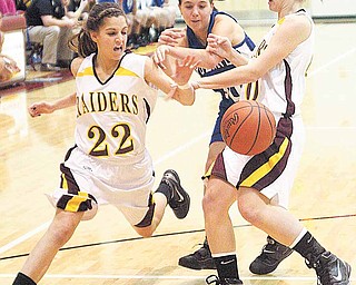 (22) Lexi Naples and (40) Elli Stoffer of South Range try to keep (10) Emily Rollo from the ball during their game Monday night.