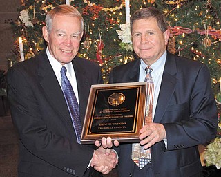 John Murphy, left, executive director of the Ohio Prosecuting Attorneys Association, presented the Outstanding Prosecuting Attorney of the Year award last week to Trumbull County Prosecutor Dennis Watkins during the organization’s annual meeting.