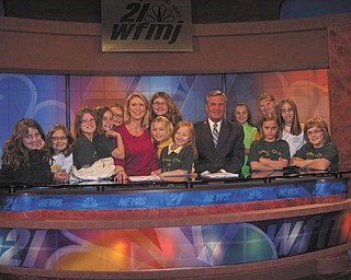 Up close and personal: A visit to the WFMJ-TV studio in Youngstown was an enlightening experience for a group of fourth-grade girls from Holy Family School, on Center Road in Poland. Led by Tina Kali, who along with Melanie Jones planned the event, the Acts of Random Kindness girls toured the studio and heard a talk by Madonna Pinkard, public relations representative. They also viewed a live news broadcast by studio personalities Cindy Matthews, Bob Black, Dana Balash and Mark Koontz. As a memento of the occasion the group posed for an official picture. Gathered for the event are, from left, Simone Izzo, Jayda Benson, Jessie Cummings, Angelina Sabatino, Brooke Chandler, Matthews, Isabella Massaro-Suchora (back), Aidan McDanel, Angelina Santora, Black, Katherine Kali, Anna Nietzel (back), Marissa Mangino, Lauren Perchak and Hannah Balash.