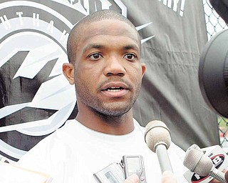 This Sept. 1, 2010, file photo shows Maurice Clarett speaking to reporters following team practice with the United Football League's Omaha Nighthawks, in Omaha, Neb. Clarett says he would spend another year with the UFL's Omaha Nighthawks if they want him back. He told The Associated Press that the Nighthawks' opportunity has been "a blessing from God."