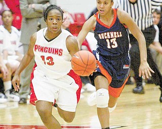 YSU's Macey Nortey drives past Bucknell's Alyssa Dunn during first half action Wednesday, Nov. 24, 2010.