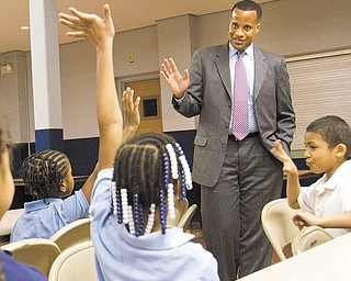 Mayor Jay Williams speaks with children about the importance of school and his job as mayor during an afterschool program at Christ Church Presbyterian Church.