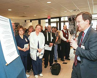 Robert Shroder, Humility of Mary Health Partners president and chief executive officer, reads the proclamation of the purpose of St. Elizabeth Health Center during ceremonies Wednesday kicking off the hospital’s yearlong centennial celebration. The celebration will culminate on Dec. 8, 2011, the date in 1911 when the Sisters of the Humility of Mary started the medical facility.