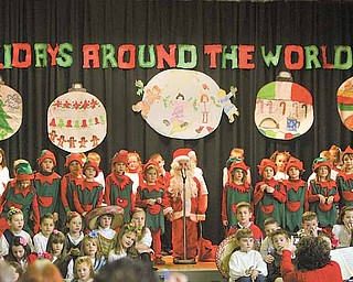 Santa and his elves marched into the gym at the beginning of the performance of “Holidays Around the World” at Lloyd Elementary School in Austintown. The role of Santa has been played by a first-grader each of the past 30 years.
