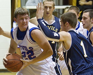 Western Reserve's Thomas Benyo (22) tries to fight off McDonald's Justin Rota (1) during a game at Western Reserve High School on Friday evening.