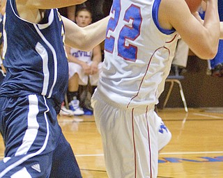 McDonald's Tony Ingalls (33) reaches for the ball catching Western Reserve's Thomas Benyo (22) during a game at Western Reserve High School on Friday evening.