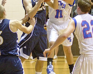 McDonald's Nick Rota (23) wrestles for control of the ball with Western Reserve's Thomas Marlowe (11) during a game at Western Reserve High School on Friday evening.
