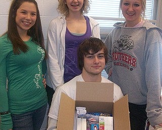 Sharing their holiday cheer.The freshmen at Struthers High School participated in The Vindicator's Operation Holiday Cheer project recently. The students put together 17 packages and wrote 180 letters to send to area soldiers. Among those involved in the project were, from left, Maria DeAngelis, Lindsey Opritza, Alyssa Patterson and Bill McCulloch.