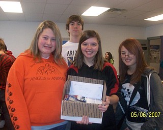 The freshmen at Struthers High School participated in The VindicatorÕs Operation Holiday Cheer project recently. The students put together 17 packages and wrote 180 letters to send to area soldiers. Among those involved in the project were, from left, Amanda Svenson, Crystal Karnes, Evan John and Caitlyn Schuller.