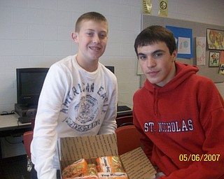 The freshmen at Struthers High School participated in The Vindicator's Operation Holiday Cheer project recently. The students put together 17 packages and wrote 180 letters to send to area soldiers. Among those involved in the project were Pat Carden, left, and Brandon Kish.