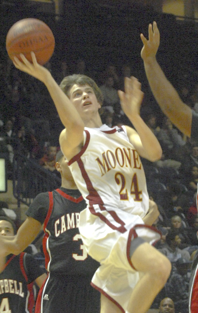 Cardinal Mooney High School Senior Danny Reese drives to the hoop during the 6th annual Youngstown-Warren Holiday Basketball Classic at the Covelli Centre. The Cardinals defeated the Campbell Memorial Red Devils 49-36.