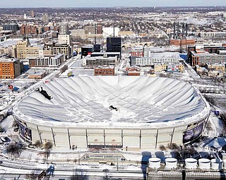 The collapsed Metrodome can be seen in Minneapolis Sunday, Dec. 12, 2010. The inflatable roof of the Metrodome collapsed Sunday after a snowstorm that dumped 17 inches on Minneapolis. No one was hurt, but the roof failure sent the NFL scrambling to find a new venue for the Vikings' game against the New York Giants.