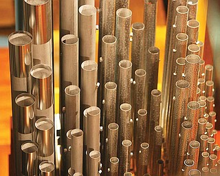 Stambaugh Auditorium’s E.M. Skinner Co. pipe organ, top, first installed in 1926 when the auditorium opened, has been refurbished for $1.4 million. The organ is the only remaining Skinner in the area. Its pipes vary from one the size of a pencil to one that’s 32 feet long and weighs 750 pounds.