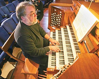 Richard Konzen plays. The professor of music at Grove City College and nationally renowned organist helped to show off the organ Monday.