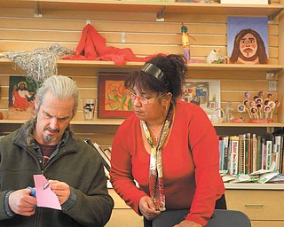 Steven Reese and Ida Morales of Youngstown participate in a free printmaking class at the D.D. and Velma Davis YMCA in Boardman. The facility is offering free art classes each day this week.