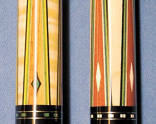 Pool cues made by former Valley resident Mike Gulyassy, owner of Baby’s Pro Shop in Greenville, S.C., are high-end cues made from ivory, elephant skin, tulip wood (left) and red heartwood (right). Gulyassy designs special cues for Strickland.