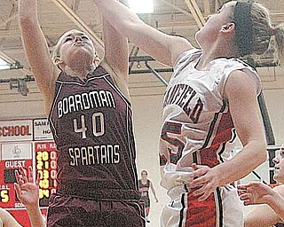 BASKETBALL - (40) Kayleigh Lipke of Boardman and (15) Abby Baker fight for the ball during their game Wednesday night in Canfield. (44) Sabrina Mangapora (23) Sarah Vrabel of Canfield and (21) Brooke Meenachan of Boardman are in on the play.