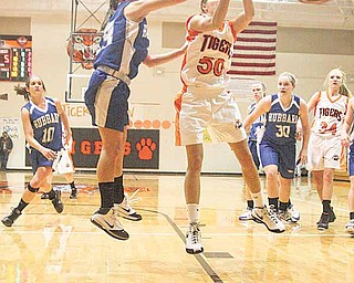 (13) Allie Deluco of Hubbard and (50) Destiny Prusky fight for the ball Thursday night.