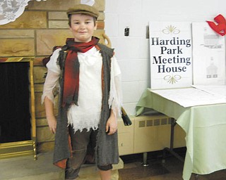 Tiny Tim and tea: The 50 women attending the Holiday Tea Luncheon hosted by the Harding Park Meeting House committee in Hubbard on Dec. 11 were greeted with a cheery “ ’ello” from Tiny Tim, played by Nathan Clark, above, who invited them for a “lovely cup of tea.” As they enjoyed a five-course lunch, Linda Ruggles on the piano and Sarah Clark on the harp entertained the diners. State Sen. Capri Cafaro was among the guests. The tea luncheon fundraiser, hosted by the nonprofit Harding House committee and Hubbard Rotary, contributes to the goal of building the Harding Park Meeting House. The meeting house will incorporate parts of the original 1857 church that once stood on Liberty Street and a section will be dedicated to a historical view of the building over the years, featuring artifacts and photos dating back to 1857. For more information on this nonprofit group and this project, go to the Harding Park Meeting House Facebook page or the website at www.hardingparkmeetinghouse.org.
