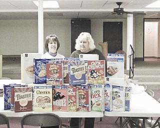 Bowled over by cereal: Austintown Kiwanis, led by Vice President Mary Ann Herschel, left, and President Carole Powers, collected more than 40 boxes of cereal as a Christmas project for the club. The cereal will be donated to the Salvation Army to be given to needy families in the area. The club designates the last Wednesday of each month as Kiwanis Cereal Day to help the Salvation Army all year long.