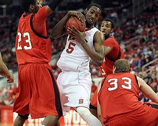North Carolina State's C.J. Leslie (5) pulls down an offensive rebound surrounded by three Youngstown State players during first half of an NCAA college basketball game on Thursday, Dec. 16, 2010, at the RBC Center in Raleigh, N.C. (AP Photo/TheNews & Observer, Michael McLoone)