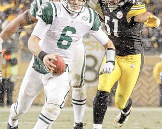 New York Jets quarterback Mark Sanchez (6) scambles up the middle past Pittsburgh Steelers linebacker James Farrior (51) for 6-yards during the fourth quarter of an NFL football game in Pittsburgh, Sunday, Dec. 19, 2010. The Jets won 22-17. 