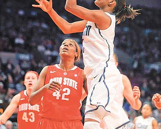 Connecticut's Tiffany Hayes, right, shoots against Ohio State's Jantel Lavender in the second half of an NCAA college basketball game in the Maggie Dixon Classic at Madison Square Garden in New York, Sunday, Dec. 19, 2010. Connecticut won its 88th game in a row, 81-50.