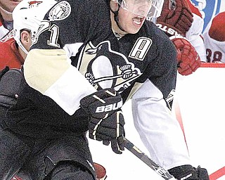 Pittsburgh Penguins' Evgeni Malkin (71), of Russia, skates past a Phoenix Coyote defender during the second period of an NHL hockey game in Pittsburgh on Monday, Dec. 20, 2010. The Penguins won 6-1. Malkin tied a career high with five points.