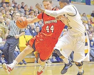 YSU Vytas Sulskis rushes by KSU Rodriquez Sherman during the first period on Tuesday night at the Kent State MAC center in Kent, Ohio.