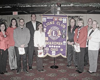 The pride of new Lions: Boardman Lions Club had its Christmas dinner at the Saxon Club on Dec. 9. Lion Bill Rausch, the new zone chairman of District 13-D Zone 5, installed five new members. From left to right are President Mary Beth Shobel; Director Jaclyn Rausch; new members Bob Pavalko, Lee Ward, Mandy Ward, John Landers and Kathy Collins; Rausch; and Director Karen Kannal.