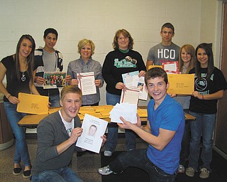 For a second year, students in West Branch High School's mentoring program, Freshmen Focus, participated in The Vindicator's Operation Holiday Cheer project. The students chose 16 servicemen and women, some of whom are graduates of West Branch, to send Christmas cards and letters. Pictured, from left, are: first row, Robert Brand (12th grade) and Zach Altman (12th grade), and second row, Taylor Metzgar (12th grade), Parker Zamarelli (9th grade), Mrs. Erica Polinori (mentor teacher), Mrs. Brenda Sharp (mentor teacher), Kahliel Fletcher (9th grade), Molly Wyss (9th grade) and Hayley Kozar (9th grade). Freshmen Focus is a yearlong mentoring program in which 11th- and 12th-grade students mentor freshmen.