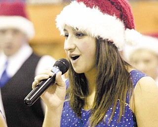 Alyssa Carline, a sophomore, introduces herself during a concert put on the by the Poland High School show choir at Union Elementary.