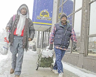 Among the food recipients were Robert Jones, left, and Ricky Paige, both of Youngstown.