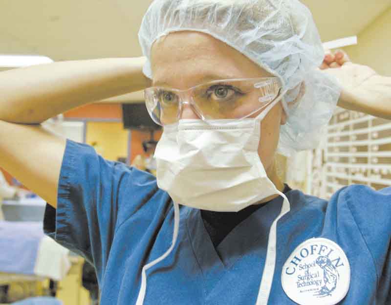 Katie Ann Guarino of Warren prepares for a class surgical procedure. She is a student in the surgical-technology program.